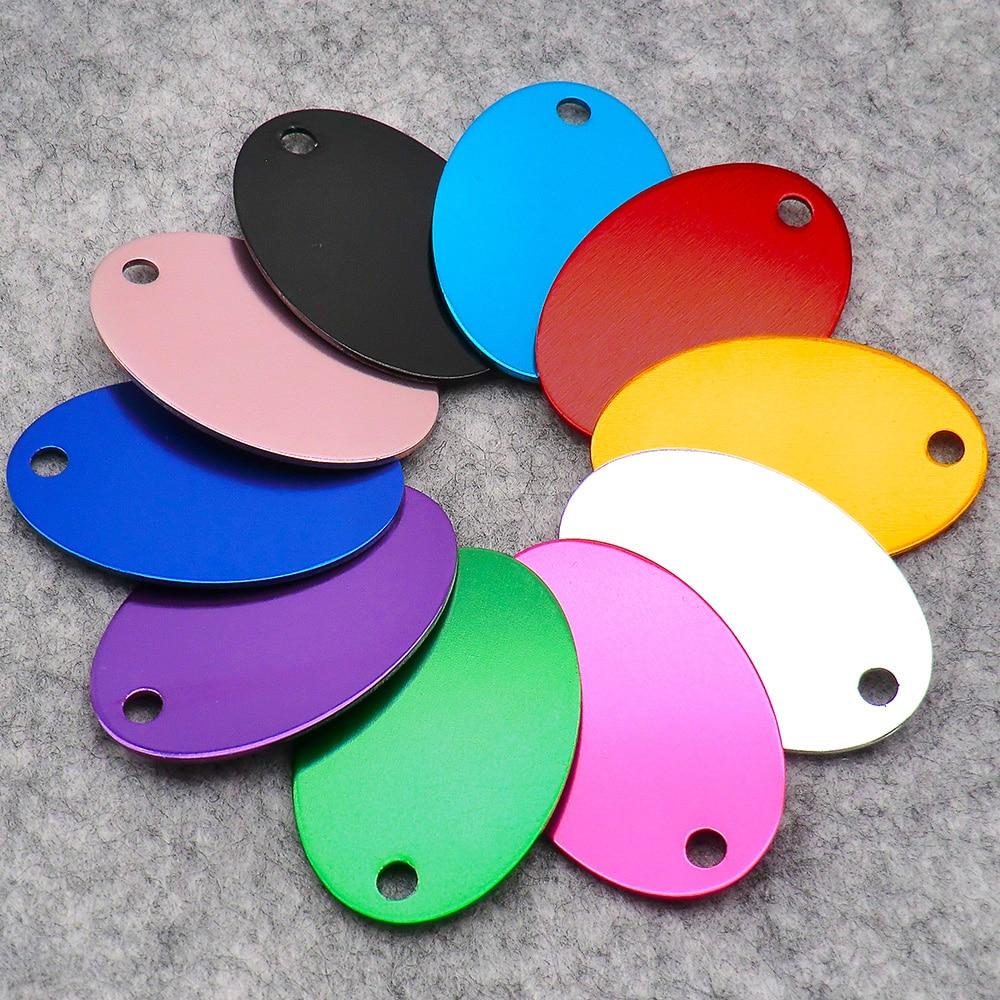 Wholesale pack of 100 oval aluminum pet ID tags, customizable with names and phone numbers, ideal for dog collars.